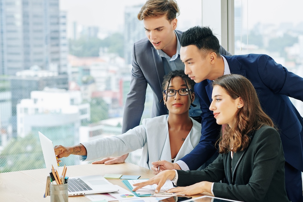 marketing team going over computer work