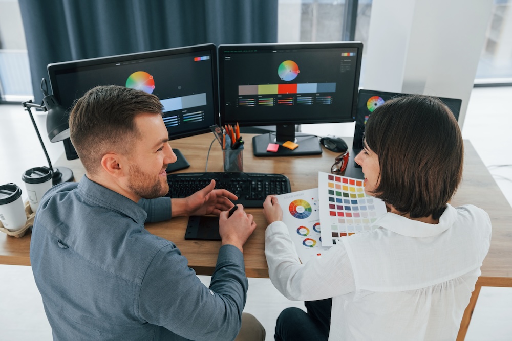 two people working together to help create data content